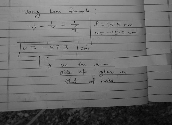 Using Lens formula : V-5 f=15.5 cm u=-12- 2cm - - 57.3 cm est on side that the of same glass mole as of