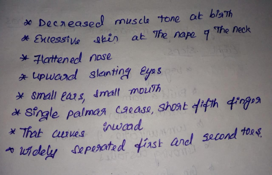 & Decreased muscle tone at bigth * Excessive ekis at the nape 9 The neck * Flattened nose * upward slanting eyes * small ears