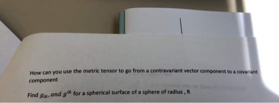 How can you use the metric tensor to go from a contravariant vector component to a covariant component gk for a spherical sur