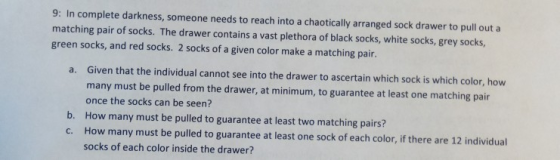9: In complete darkness, matching pair of socks. The drawer contains a vast plethora of black socks, white socks, grey socks,