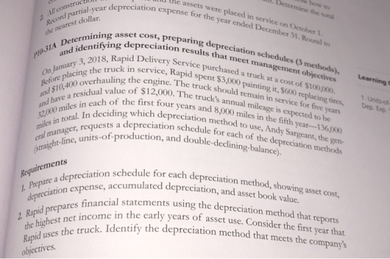 the assets were placed in service on October 1 rion expense for the year ended December 31. Round to At Determine the total r