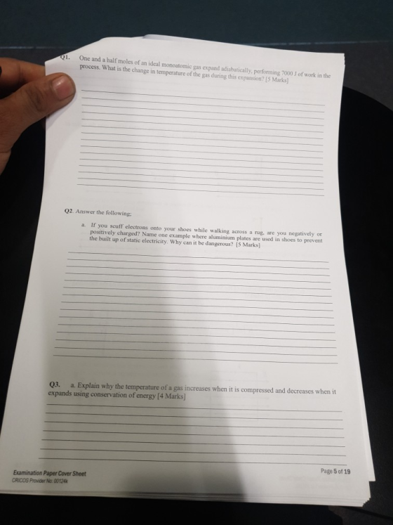 Q1. One and a half moles of an ideal monoatomic gas expand adiabatically, performing 7000 J of work in the process. What is t