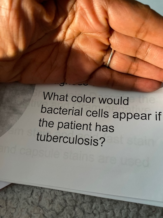 What color would ine bacterial cells appear if the patient has tuberculosis? and capsule stains