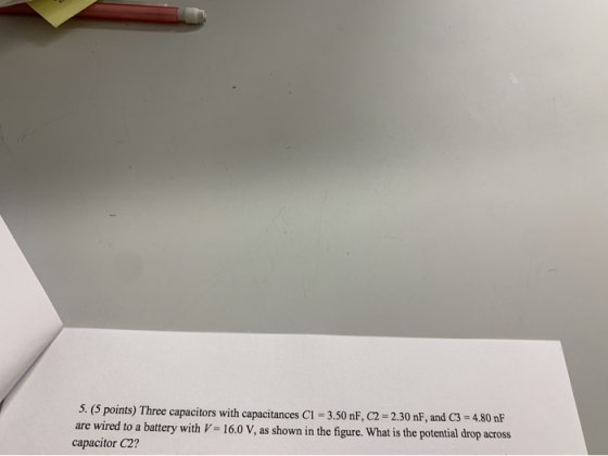 5. (5 points) Three capacitors with capacitances C1 = 3.50 nF, C2 = 2.30 nF, and C3 = 4,80 nF are wired to a battery with V =