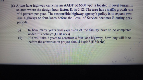 (a) A two-lane highway carrying an AADT of 6600 vpd is located in level terrain in an area where the design hour factor, K, i