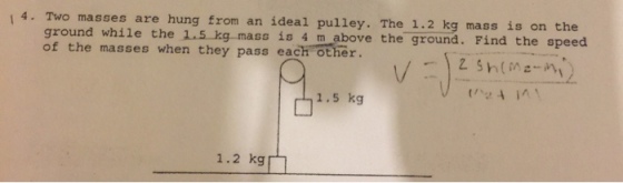 Two masses are hung from an ideal pulley. The 1.2