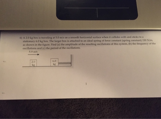 A 2.0 kg box is traveling at 5.0 m/s on a smooth h