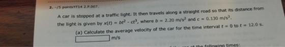 A car is stopped at a traffic light. It then trave