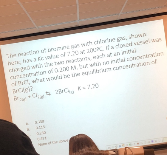 The reaction of bromine gas with chlorine gas, shown here, has a kc value of 7.20 at 200°C. If a closed vessel was charged wi