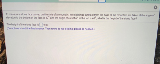 To measure a stone face carved on the side of a mountain, two sightings 600 feet from the base of the mountain are taken. If
