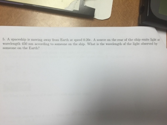 A spaceship is moving away from Earth at speed 0.2