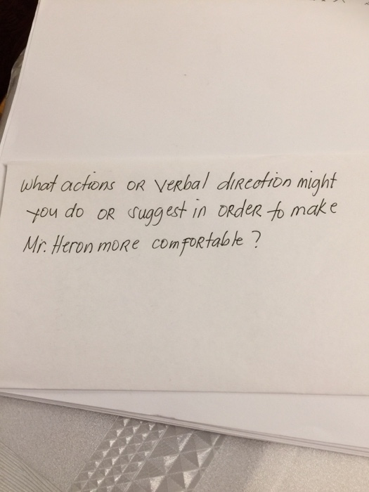 what actions OR verbal direction might I you do OR suggest in order to make Mr. Heron more comfortable ?