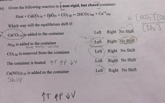 ts) Given the following reaction in a non-rigid, but closed container: Heat +CaCO3(-) + H2O + CO2(g) + 2HCO3–(aq) + Cat2(aq)