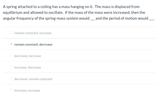 A spring attached to a ceiling has a mass hanging on it. The mass is displaced from equilibrium and allowed to oscillate. If
