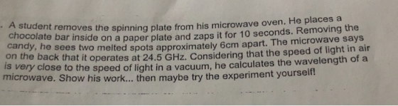 chocolate bar inside on a paper plate • A student removes the spinning plate from his microwave oven. ng plate from his micro