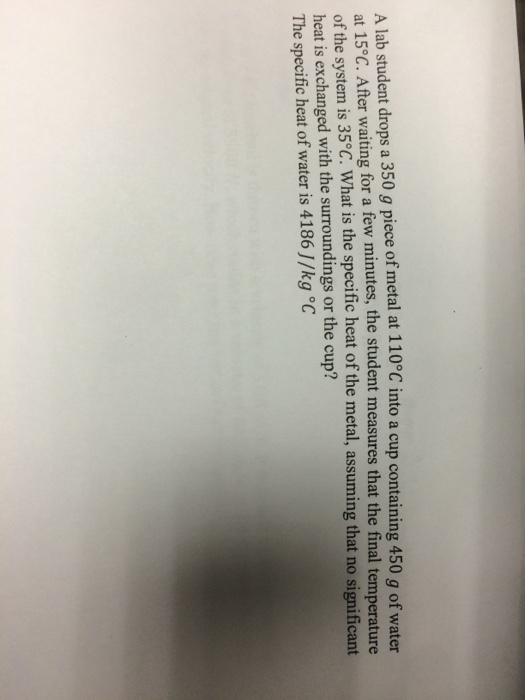 A lab student drops a 350 g piece of metal at 110
