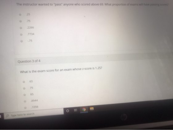 The instructor wanted to pass anyone who scored above 69. What proportion of exams will have passing score 25 75 .2266 7734