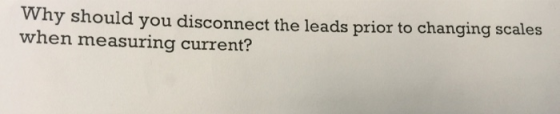 Why should you disconnect the leads prior to changing scales when measuring current?