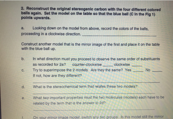2. Reconstruct the original stereogenic carbon with the four different colored balls again. Set the model on the table so tha
