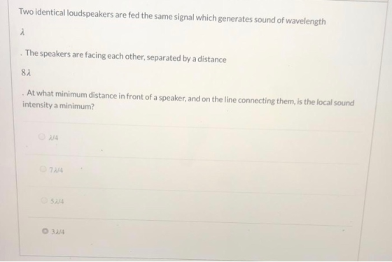 Two identical loudspeakers are fed the same signal which generates sound of wavelength i The speakers are facing each other,