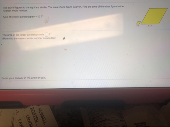 The pair of figures to the right are similar. The area of one figure is given. Find the area of the other figure to the neare